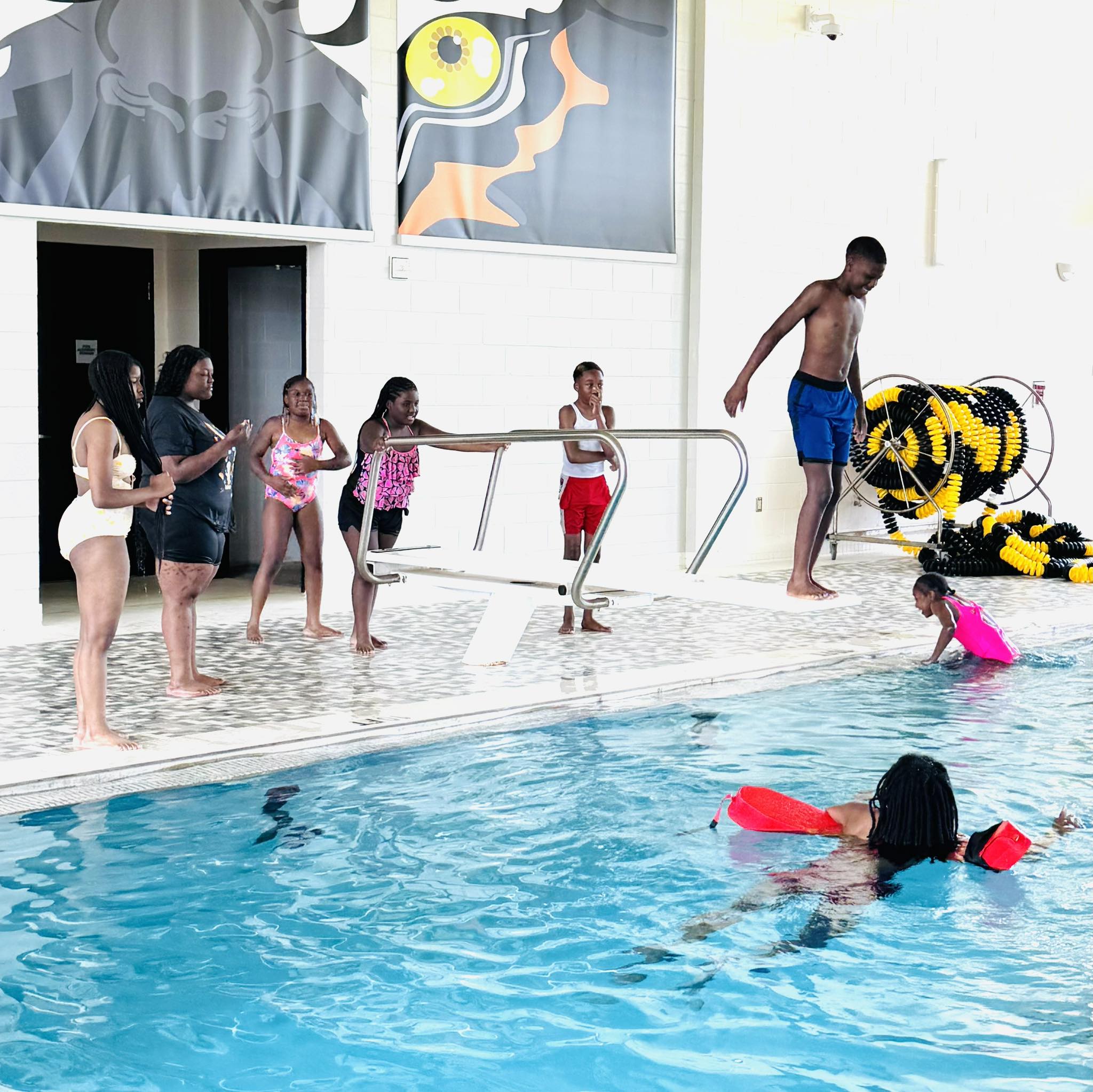 A boy on a diving board.